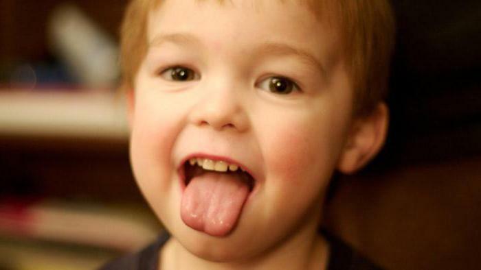 White coating on the root of the tongue of the child